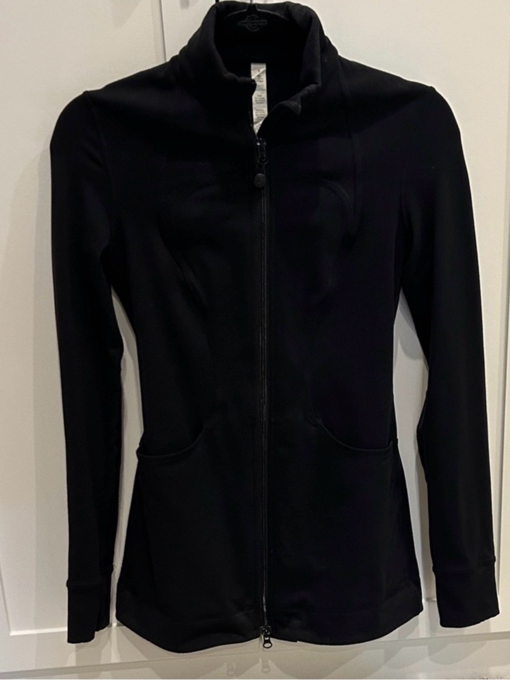 Lululemon size 4 long black jacket. Very good condition. Some small pilling